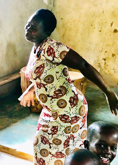 Teacher dancing at Kibale school